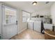 Laundry room equipped with washer, dryer, utility sink, and exterior access at 1841 Casco St, Lakeland, FL 33801