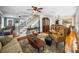 Spacious living room with hardwood floors, a staircase and views of the dining room and kitchen at 1841 Casco St, Lakeland, FL 33801