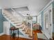 Bright staircase with hardwood floors, natural light and views into the adjoining living space at 1841 Casco St, Lakeland, FL 33801