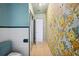 Hallway featuring a shower and vintage floral wallpaper at 1925 John Arthur Way, Lakeland, FL 33803