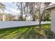 A well-maintained yard features a new white privacy fence and mature trees at 1961 Rocky Pointe Dr, Lakeland, FL 33813