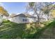The spacious backyard with mature trees and a well-maintained lawn at 1961 Rocky Pointe Dr, Lakeland, FL 33813