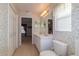 Spacious bathroom featuring double sinks, large mirror, and tiled flooring at 1961 Rocky Pointe Dr, Lakeland, FL 33813