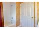 Traditional bathroom showing shower/tub and a white door at 1961 Rocky Pointe Dr, Lakeland, FL 33813