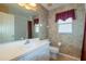 Comfortable bathroom with tub/shower combo and single sink at 1961 Rocky Pointe Dr, Lakeland, FL 33813