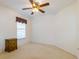 A bedroom showcasing a window and neutral carpet. The room is bright and airy at 1961 Rocky Pointe Dr, Lakeland, FL 33813