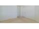 Empty room featuring neutral carpeting, white trim, and two doors at 1961 Rocky Pointe Dr, Lakeland, FL 33813