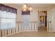 Cozy dining area with a large window, blinds, and unique floral wallpaper at 1961 Rocky Pointe Dr, Lakeland, FL 33813