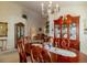 Formal dining room with a wooden table, ornate china cabinet, and elegant chandelier at 1961 Rocky Pointe Dr, Lakeland, FL 33813