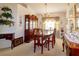 Elegant dining room with traditional furnishings, a chandelier, and decorative window treatments at 1961 Rocky Pointe Dr, Lakeland, FL 33813