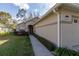 Well-maintained home exterior with manicured lawn and walkway leading to the entrance at 1961 Rocky Pointe Dr, Lakeland, FL 33813