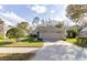 Charming single-story home featuring a well-manicured lawn and two-car garage at 1961 Rocky Pointe Dr, Lakeland, FL 33813
