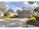 Spacious two-car garage and well maintained lawn and landscaping at 1961 Rocky Pointe Dr, Lakeland, FL 33813