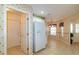 Bright kitchen with decorative wallpaper, tiled floors and white appliances at 1961 Rocky Pointe Dr, Lakeland, FL 33813