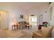 Inviting living room featuring a comfortable sofa and chairs, and neutral decor at 1961 Rocky Pointe Dr, Lakeland, FL 33813