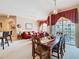 Open living space with dining area and living room, featuring natural light and neutral tones at 205 Terrace Ridge Cir # 205, Davenport, FL 33896