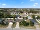 Residential street featuring well-maintained homes with manicured lawns, mature trees, and diverse designs at 2160 Country Manor St, Bartow, FL 33830