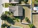 Aerial view of a home with a large backyard, manicured landscaping, and a privacy fence at 2160 Country Manor St, Bartow, FL 33830