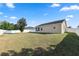 View of the spacious backyard and exterior home at 2160 Country Manor St, Bartow, FL 33830