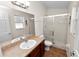 Well-lit bathroom featuring a glass-enclosed shower, a vanity with a sink, and neutral-toned walls for a clean look at 2160 Country Manor St, Bartow, FL 33830