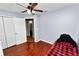 This bedroom has beautiful flooring, ceiling fan and is freshly painted at 2160 Country Manor St, Bartow, FL 33830