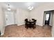 Tile-floor dining room with seating for four; bright room is located near the front door at 2160 Country Manor St, Bartow, FL 33830