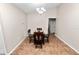 Dining room features tile floors and glass-top table with wooden chairs under a modern chandelier at 2160 Country Manor St, Bartow, FL 33830