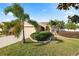 Charming one-story home featuring a well-manicured lawn and mature landscaping at 2160 Country Manor St, Bartow, FL 33830