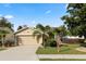 Charming single-story home featuring a well-manicured lawn and mature trees at 2160 Country Manor St, Bartow, FL 33830