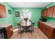 Kitchen features a breakfast table, tile floors, wooden cabinets and ample counter space at 2160 Country Manor St, Bartow, FL 33830