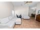 Inviting living room with tiled floors, comfortable seating, and an adjacent dining area with a wooden table at 2160 Country Manor St, Bartow, FL 33830