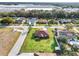 Cozy home with a manicured lawn, surrounded by a neighborhood setting, enhanced by a palm tree in the front yard at 2420 Delrose E Dr, Lakeland, FL 33805