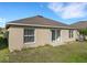 A spacious backyard area showcasing well-maintained lawn and the home's rear facade at 2454 Harrison Place Blvd, Lakeland, FL 33810