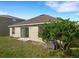 An inviting backyard features a lush lawn and partial view of the home's exterior at 2454 Harrison Place Blvd, Lakeland, FL 33810