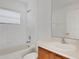 Well-lit bathroom featuring a bath tub and a vanity with sink at 2454 Harrison Place Blvd, Lakeland, FL 33810