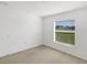 Bright bedroom featuring a window offering outdoor views at 2454 Harrison Place Blvd, Lakeland, FL 33810