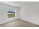 Bright bedroom featuring a window offering outdoor views at 2454 Harrison Place Blvd, Lakeland, FL 33810