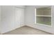 Bright bedroom featuring a window and closet space at 2454 Harrison Place Blvd, Lakeland, FL 33810