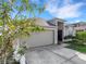 Charming single-story home with an attached two-car garage and neutral color palette at 2454 Harrison Place Blvd, Lakeland, FL 33810