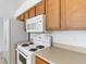 A close up of the kitchen features white appliances and plenty of cabinet space at 2454 Harrison Place Blvd, Lakeland, FL 33810