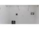 A bright laundry room features hookups, electrical outlet and wire shelving at 2454 Harrison Place Blvd, Lakeland, FL 33810