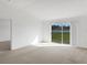Bright and airy living room with sliding glass door to exterior at 2454 Harrison Place Blvd, Lakeland, FL 33810