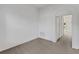 Bright room with white walls and arched doorway provides a view to exterior lake at 2454 Harrison Place Blvd, Lakeland, FL 33810
