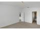 Large main bedroom features light walls, neutral carpet and an ensuite bathroom at 2454 Harrison Place Blvd, Lakeland, FL 33810