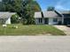 Cozy single-story home with a tidy front yard and a welcoming entrance at 256 Village View Ln, Lakeland, FL 33809