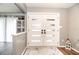 Bright foyer features white double doors, a modern light fixture, and a decorative rug on hardwood flooring at 280 Spring Lake Hills Dr, Altamonte Springs, FL 32714