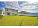 Spacious, green backyard with white fence, perfect for outdoor entertaining and recreation at 2816 Ivy Lake Ct, Lakeland, FL 33811