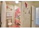 Bathroom with a shower featuring unique pink themed shower curtain and decorative elements at 2816 Ivy Lake Ct, Lakeland, FL 33811