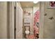 Bathroom featuring a toilet, cabinet, and a pink themed shower curtain and decor at 2816 Ivy Lake Ct, Lakeland, FL 33811