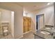 Well-lit bathroom features double granite vanity and shower with patterned curtain at 2816 Ivy Lake Ct, Lakeland, FL 33811